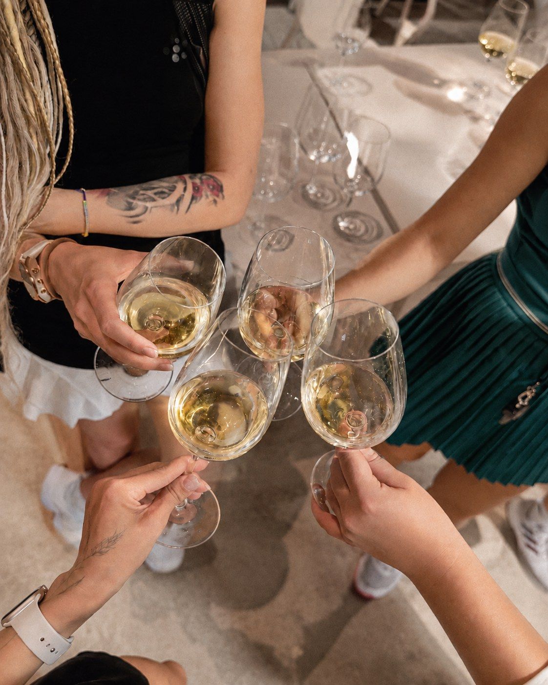 Friends toasting with glasses of white wine